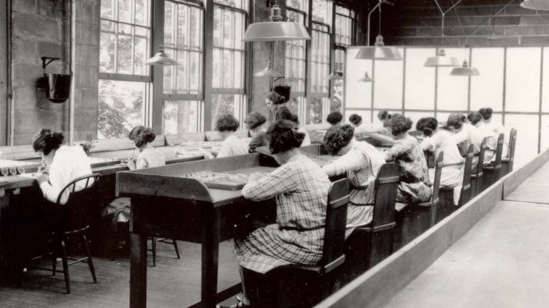 Employees of the U.S. Radium Corp. paint numbers on the faces of wristwatches using dangerous radioactive paint. Dozens of women, known as "radium girls," later died of radium poisoning. One of the last radium girls died this year at 107. 