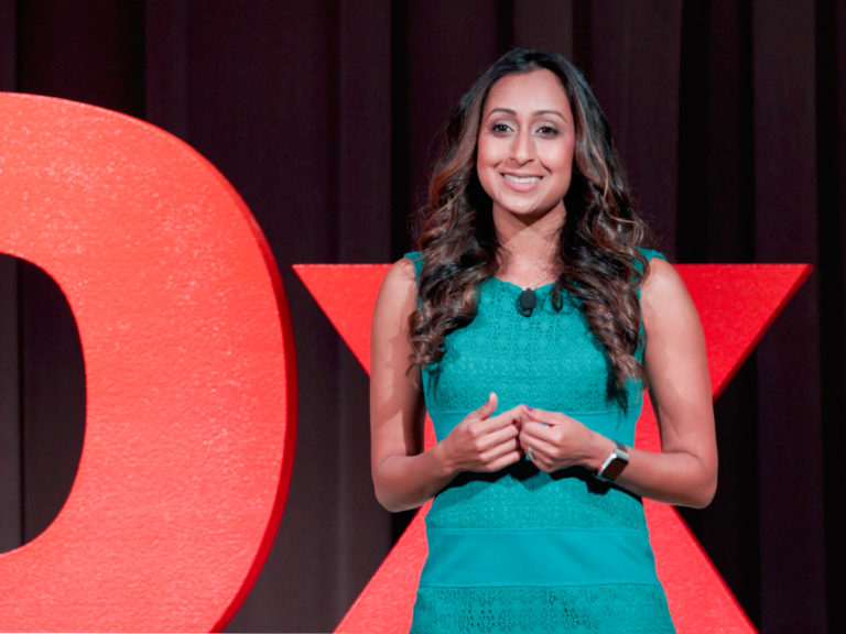 Sheetal DeCaria speaks at TEDxOakParkWomen 2022. Photo courtesy of TED.